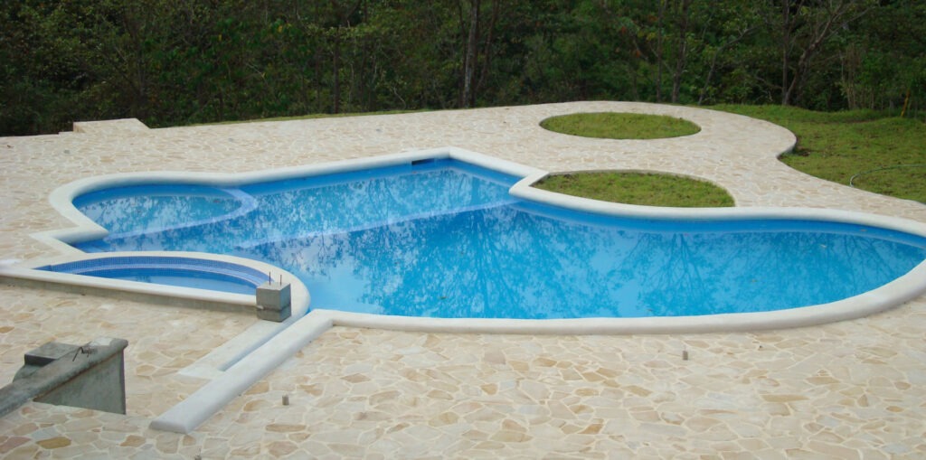playa jaco, pool builders, natrual stone deck,