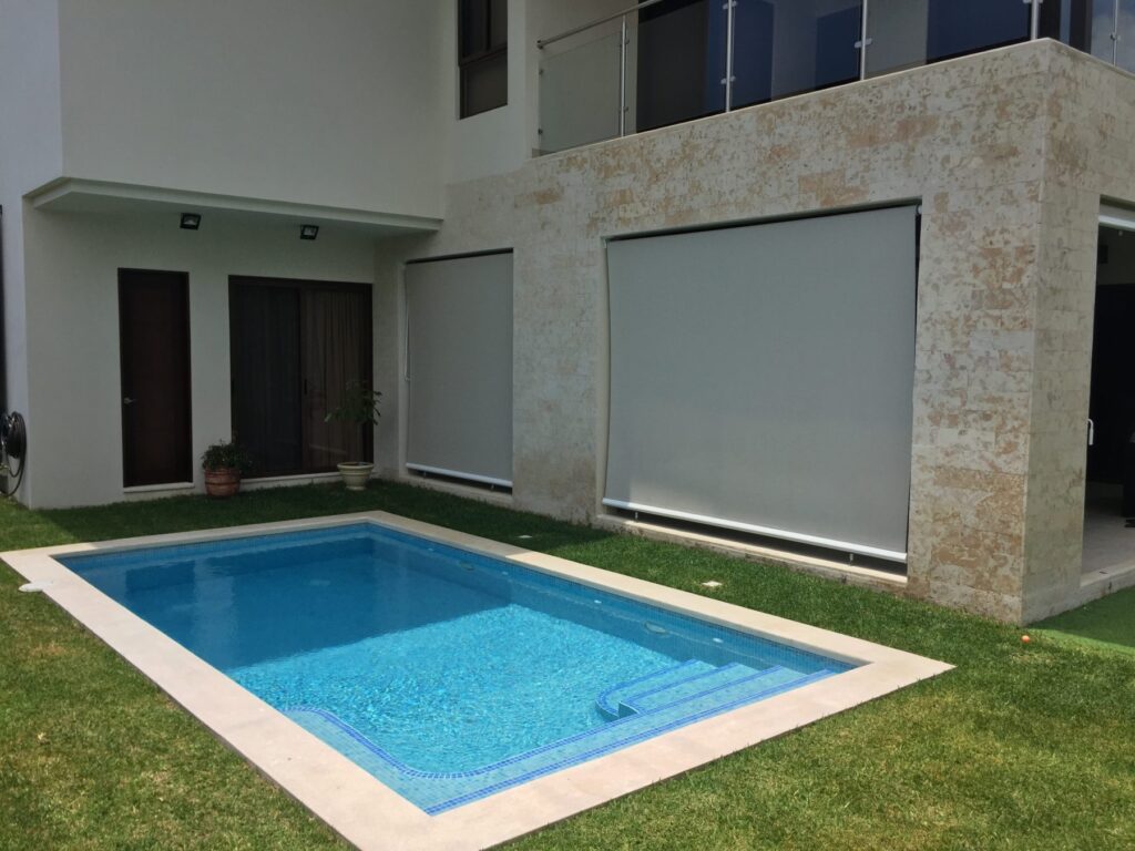 rectangular pool features vibrant blue Spanish tiling