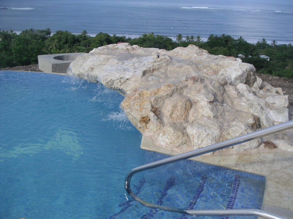 pool handrails, natural rocks, built in steps, ocean view