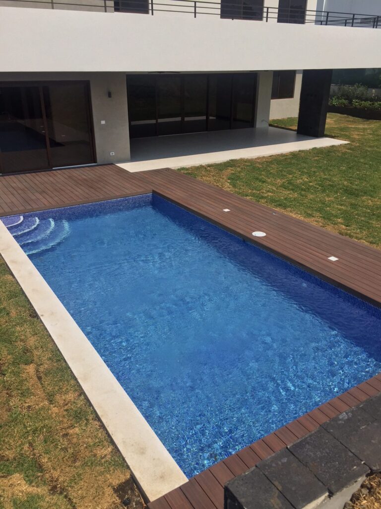 beautiful pool built by our contractor, in san jos, blue spanish tiling , wooden decks