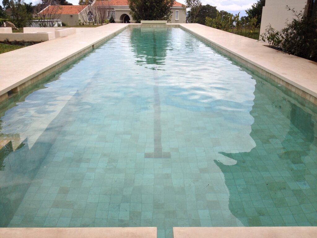 pool build, with trevertine pool finish