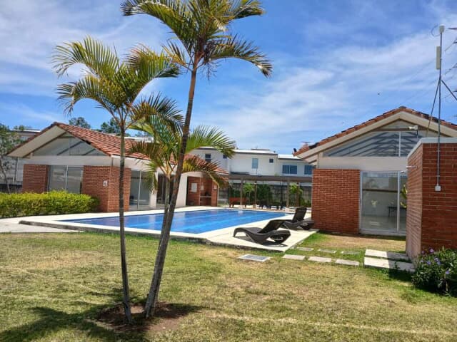 pool lounge area, and gardens, in cariari